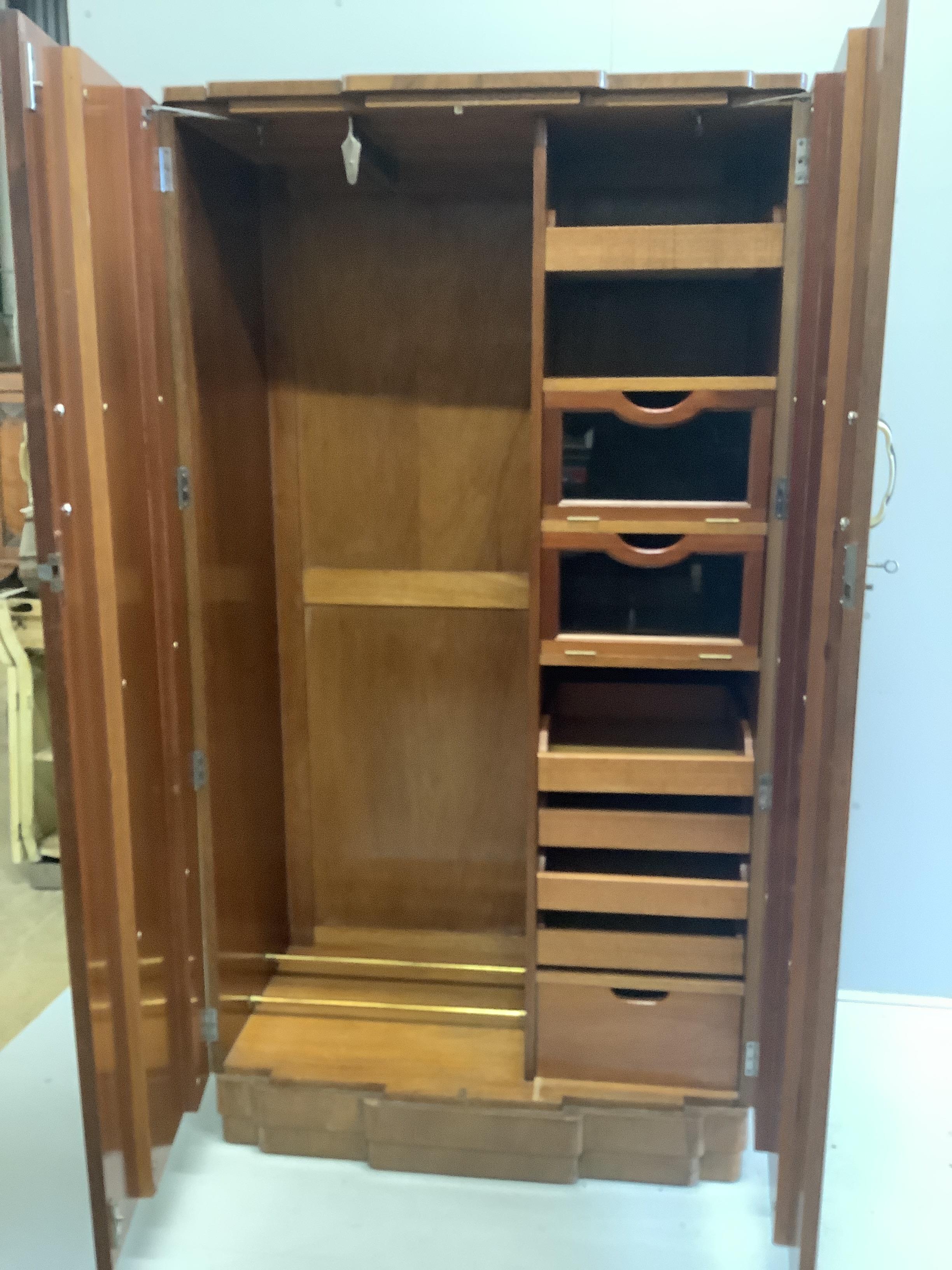 An Art Deco style burr walnut compactum wardrobe, width 96cm, depth 52cm, height 182cm
